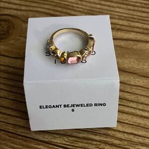 Elegant Bejeweled Ring with Pink and Gold Accents